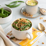 Recipe card photo of green bean casserole in a mug