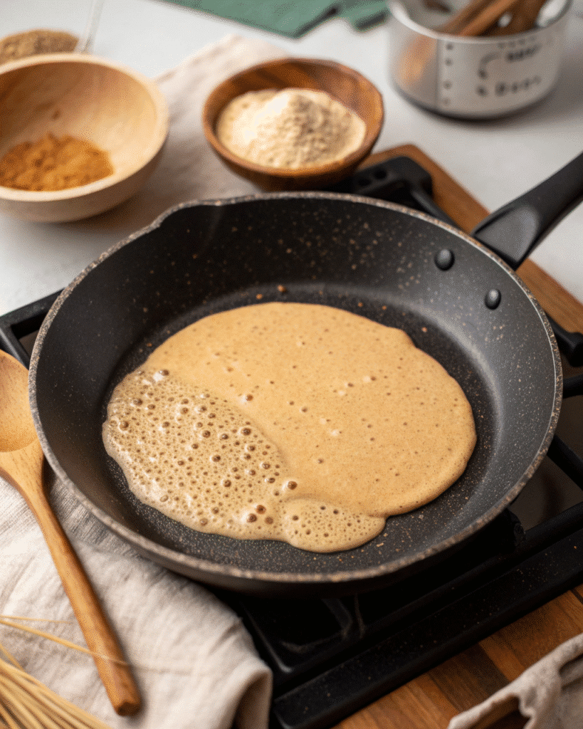 How to make Teff Injera Strips Baby Led Weaning – pouring teff batter into skillet for easy baby recipe